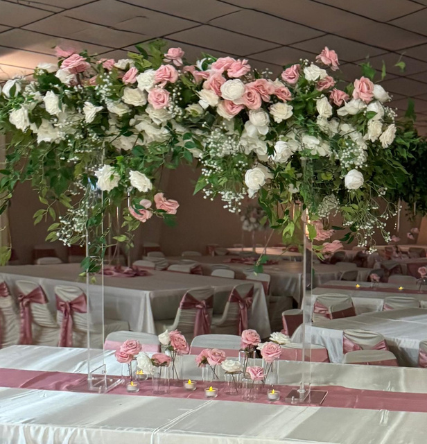 Large acrylic vase with hanging arrangement